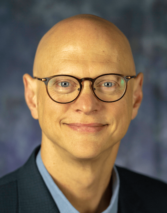 photo of Glen Kreiner against a darkblue background