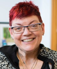 photo of Nancy Hansen, in front of a n office background