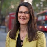 photo of Ute Stephan in front of a blurry city background