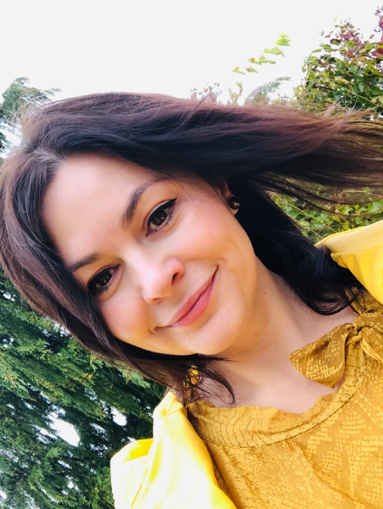 photo of Oana Branzei, photo at slight angle,trees in the background