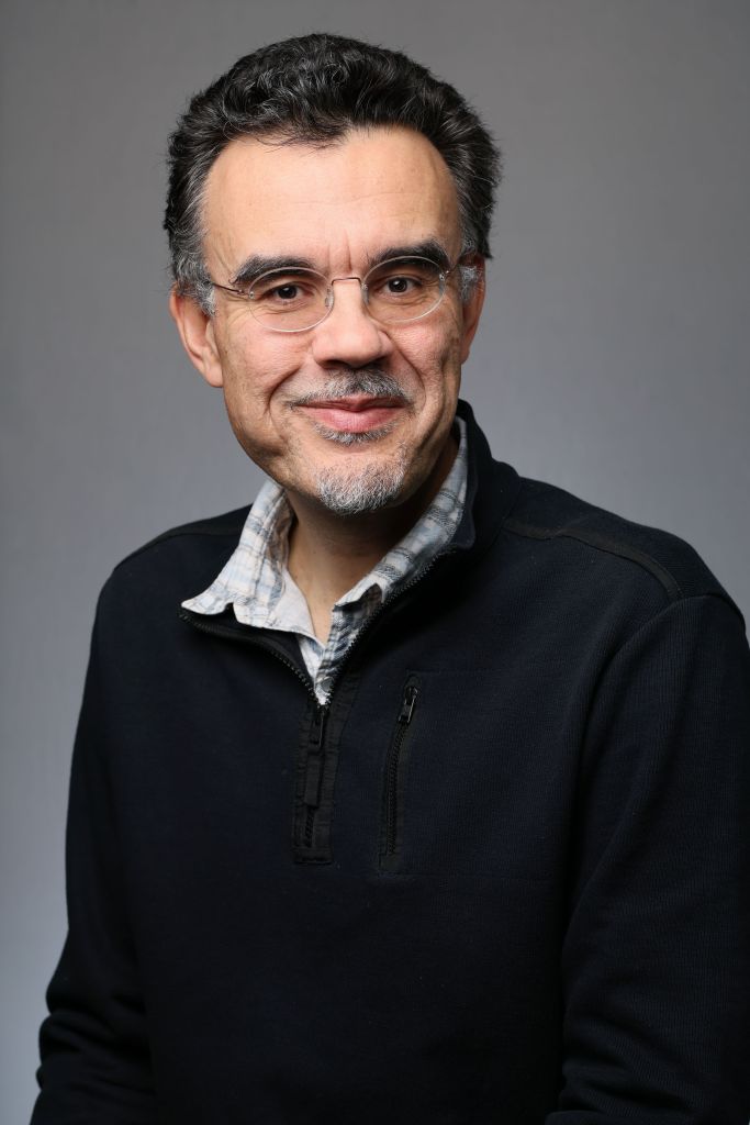 headshot of Jose Alcaraz, a middle-aged lan wearing glasses with a light beard.