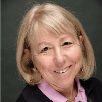 headshot of Debra Meyerson , a woman with short blonde hair just covering beyond her ears