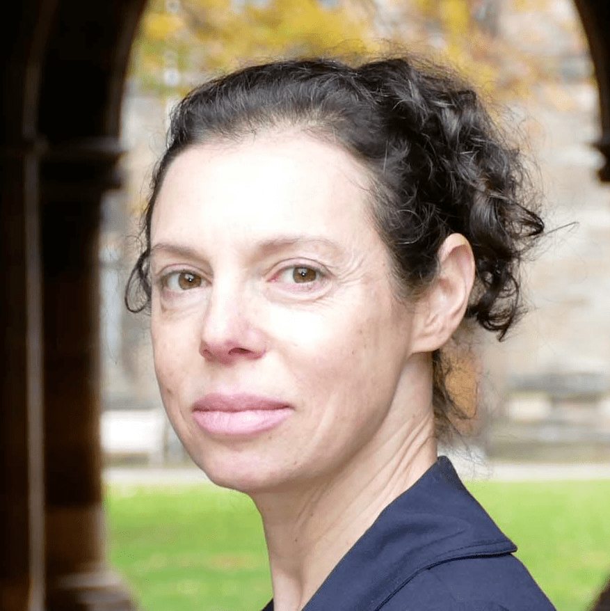 head shot of Melee Press, a light skinned woman with very ugly black hair tied back in a pony tail