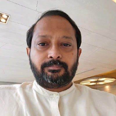 headshot of Malikajurna Iytha who has short dark hair and a full beard