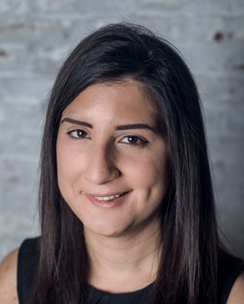 Headshot of a woman with long black hair