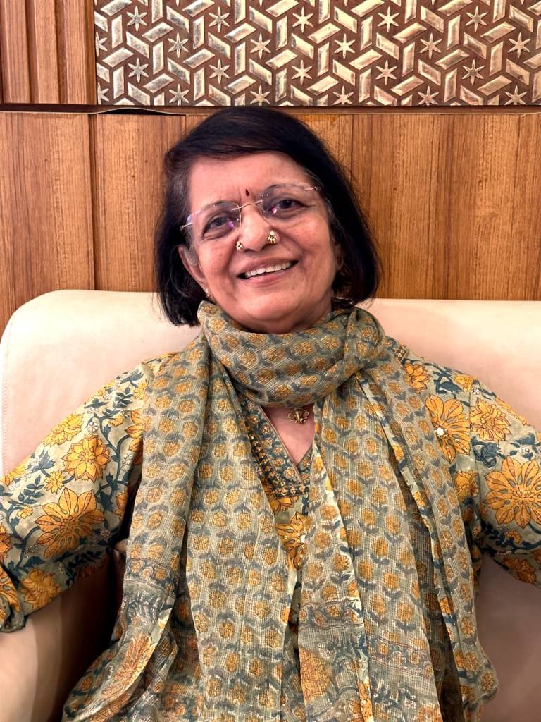 ext : I am a person with short hair, spectacles, with a bindi, wearing a green kurtha and a cheerful flowery scarf